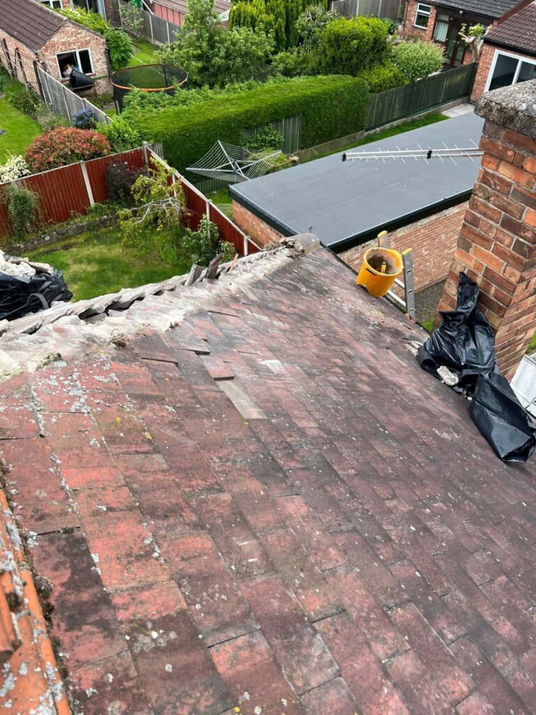 This is a photo of a roof where the hip tiles have been removed, and are just about to be replaced. Works carried out by Newark on Trent Roofing Repairs